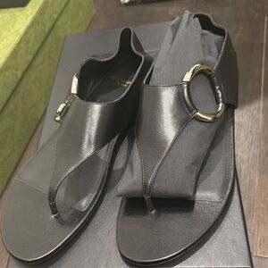 Saint Laurent Black Leather Thong Sandals with Gold Ring Accent